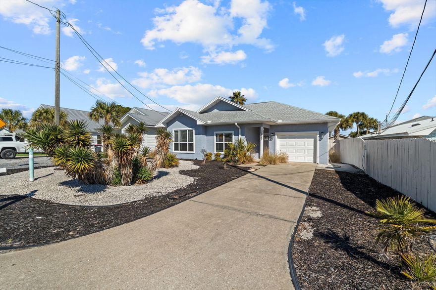 Ideally located just minutes from the sugar-white sands of Panama City Beach, this fully furnished 3-bed, 2-bath home is perfect as a short-term rental investment or personal beach retreat. No HOA and short-term rentals allowed. Conveniently located near Beach Access #16 and Rick Seltzer Park. Inside features a bright open living area with 9' ceilings, durable LVP and tile flooring, and a kitchen with stainless steel appliances stocked for immediate use. Comfortably sleeps 8-10 guests. Additional highlights include a garage with laundry, low-maintenance landscaping, fenced backyard with covered patio, Flood Zone X, and a roof approx. 3 years old. Great opportunity to own close to the beach.