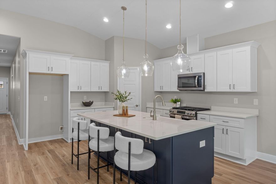 This charming, semi-custom, Craftsman-inspired new construction home blends timeless design with modern comfort, offering 3 bedrooms and 2 beautifully appointed bathrooms with 2 car garage in a thoughtfully crafted layout that feels both spacious and inviting. Designed for both everyday living and effortless entertaining, the open-concept floor plan features 9-foot ceilings throughout and a stunning family room with soaring vaulted ceilings that create a light-filled, airy atmosphere. The kitchen is a true showpiece, complete with elegant quartz countertops, stainless steel appliances, a freestanding gas range, tall custom cabinetry with crown molding, blue island and ample workspace--perfect for hosting gatherings or or enjoying quiet evenings at home. Modern efficiency meets lasting comfort with a tankless water heater, providing continuous hot water whenever you need it. The primary suite serves as a private retreat, thoughtfully designed with dual vanities, a floor-to-ceiling tiled walk-in shower, freestanding soaking tub, and an oversized walk-in closet that offers both luxury and practicality. The secondary bedrooms are generously sized and ideal for family, guests, or even a home office. Every element of this home reflects quality craftsmanship and intentional design, offering the perfect balance of warmth, style, and functionality. Don't miss the opportunity to customize your home to your exact preferences where you can select color of your cabinetry, flooring, tile, countertops, interior paint, where you can add your personal touch to create something truly special. Estimated completion the end of July, 2026. *Photos are stock images and do not reflect actual lot-specific finishes. Images are of similar homes previously built*.