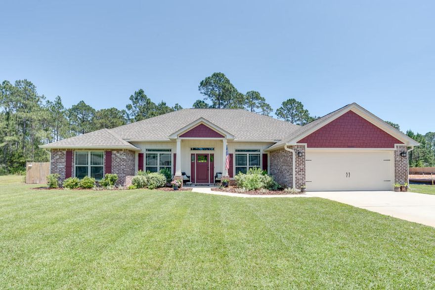 You will love this open, spacious four bedroom, three bath beauty on an extra large (.64 acre) lot on quiet street in Holley by the Sea. Walk in - to the left is the office (used as playroom) with French doors. To the right is showstopper dining room with built-in shelving/cabinets. Head into the living room, plenty of space for relaxing, and it features brand new luxury wood-look vinyl. To the right is spacious kitchen with huge island, hop up bar, and granite for days. Large, peaceful master retreat is the only bedroom on the south side of the house. Beautiful tile and glass master bath shower boasts regular and rain shower heads. Two separate hallways for additional bedrooms - guest suite has its own bathroom and separate entry to covered porch and backyard. Bedrooms three and four are in their own hallway with third bathroom. Laundry room in hallway off kitchen has its own door, no need to pass through laundry room to garage. Property backs up to wooded area, lot extends 150' beyond fence line, spacious backyard can be even bigger if you wish. You'll love sitting by the fire pit on a cool night. No power lines, utilities are underground, and home is on city sewer. Holley by the Sea membership includes recreational center privileges, to include: Clay tennis courts with lights, two Olympic size swimming pools, Weight room, locker rooms, sound front pavilion, private beach, basketball court, sauna, steam room, pavilions for cook outs, kids play area. Close to Hurlburt, Beaches. Buyer to verify all information.