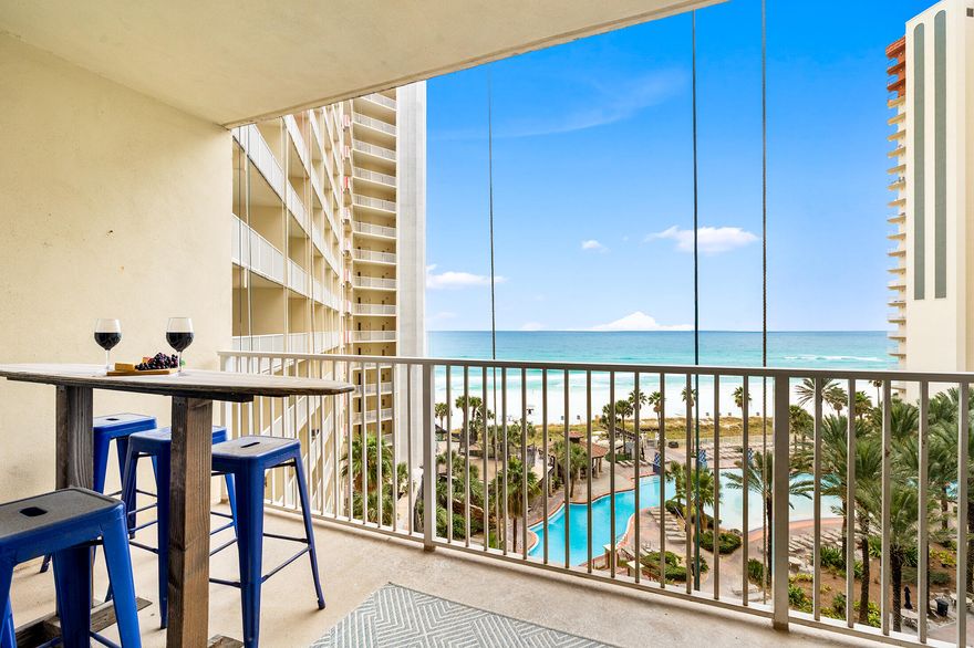 Seller is offering a COMPLETE HOME WARRANTY! Beautifully updated and fully furnished 2BR + bunkroom/3BA condo at Shores of Panama. Unit 721 sleeps 8 and features two private en-suite bedrooms plus a separate bunk room with its own full bath. Rare same-level ASSIGNED PARKING means no elevator hassle! Gulf views from the living area and kitchen, tile flooring throughout, and turnkey coastal décor. A/C and water heater approx. 5 years old. Resort amenities include 500' Gulf frontage, lagoon pool, indoor pool, hot tubs, fitness center, bars, food service, and 24/7 security. Conveniently located near Pineapple Willy's, shopping, dining, and attractions. Great primary, second home, or rental investment opportunity!