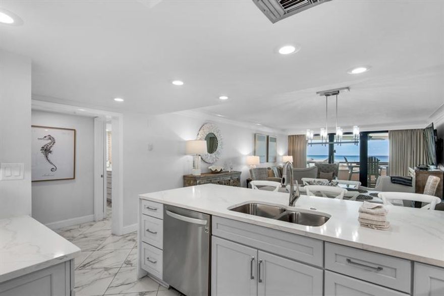 Welcome to your completely remodeled Gulf-front retreat--priced to sell and ready to deliver both luxury living and strong investment potential. Nestled within the privately gated Edgewater community, this stunning second-floor condo offers the perfect blend of elevated design and effortless beach access--just steps from the sand and resort-style pools.

Inside, you'll find designer flooring throughout and a show-stopping kitchen featuring endless custom quartz countertops, artisan-crafted soft gray cabinetry, a custom backsplash, and sleek stainless steel appliances--curated for both style and function.

The spacious master suite is a true sanctuary, complete with private balcony access and sweeping Gulf views. The spa-inspired ensuite bath showcases a large walk-in glass shower. While the guest bath offers a relaxing Roman tub/shower combo. This unit comes fully equipped w/ an in-unit washer and dryer for convenience.

Step outside to your oversized Gulf-front balcony, where sunrise coffees and sunset views become part of your daily rhythm. Additional highlights include a semi-private elevator (serving only the first and second floors) and a covered, reserved parking space beneath the building.

Edgewater's resort amenities elevate the experience even further, with two pools, a hot tub, tiki bar, fitness center, basketball courts, shuffleboard, playground, and expansive green space--all within a gated, private beach setting.

Whether you're searching for a luxury second home or a high-performing rental, this turnkey coastal gem checks every box.