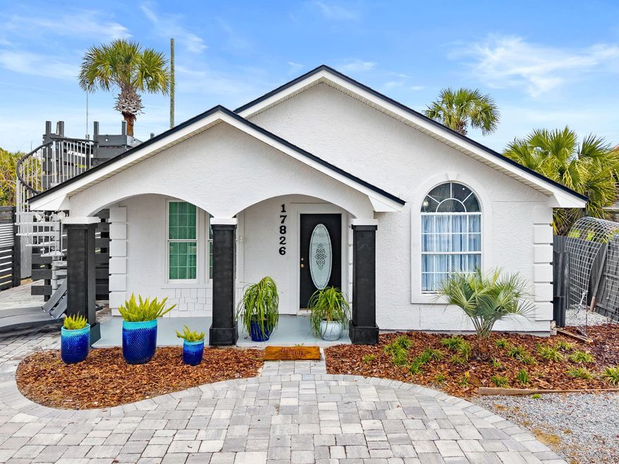 Welcome to this charming beach cottage in Panama City Beach, just steps from the Gulf. Enjoy breathtaking Gulf views and stunning sunsets from your private  lookout deck--perfect for morning coffee or evening relaxation.

Inside, the open-concept floor plan features vaulted ceilings, a cozy gas fireplace, tile flooring, and a beautifully updated kitchen with quartz countertops. The home offers ample covered outdoor living space, ideal for entertaining and beachside BBQs.

The exterior is enhanced with paver accents and includes an outdoor shower for easy cleanup after a day at the beach. Additional features include a 16x20 storage shed and a golf cart for convenient coastal living.

Located only 250 feet from Public Beach Access 76A, this fully furnished property is short-term rental eligible, with projected income potential of up to $70,000 annually. Solar panels provide added energy efficiency and help reduce utility costs.  Average electric bill for the last 12 months $104.00!  All appliances, HVAC, solar panels, roof & water heater are under 4 years old!  Enjoy the convenience of some of Panama City Beach's most popular destinations, including Carousel Supermarket, Thomas' Donuts, McGuire's Irish Pub, and Pier Park--all located approximately 0.5 to 1.5 miles away.

All measurements are approximate and should be verified if important.