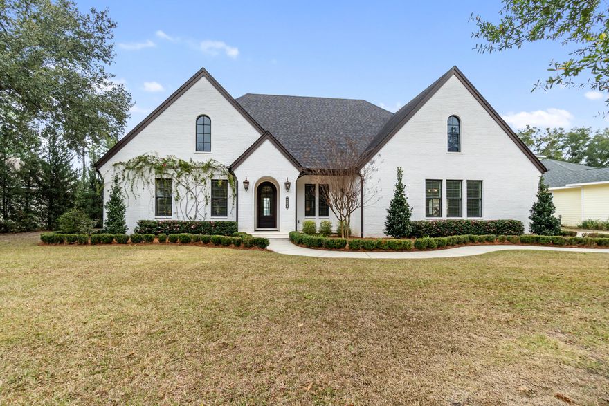 OPEN HOUSE 5/2/2026, 11AM-1PM. Welcome to the Blackwater Jewel, a rare waterfront opportunity in Bay Pointe Plantation. Situated on the largest lot in the neighborhood, this custom brick home offers panoramic views of Blackwater Bay and the advantage of an X flood zone with no flood insurance required. Built in 2018, the 3,815 sq ft residence features an open concept design with wood flooring, custom built ins, and a gas fireplace, all oriented toward the water. The kitchen includes quartzite countertops, double ovens, a custom island, and a well appointed scullery. Outdoor living shines with a covered porch, outdoor kitchen, and a private dock with boat storage, creating a true waterfront lifestyle.