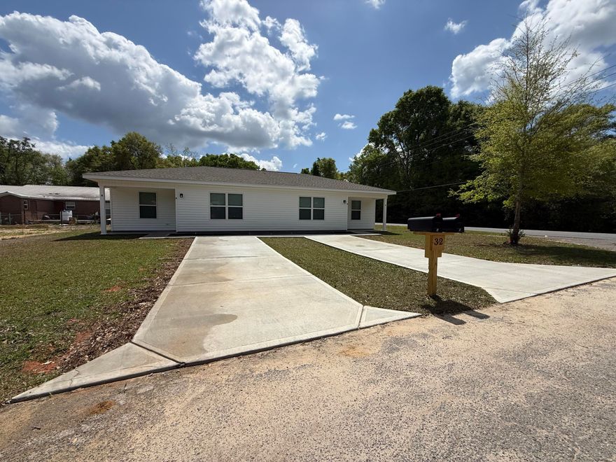 Welcome to your brand-new home, built in 2026, at 32 Constitution Avenue in DeFuniak Springs, FL! This charming 2-bedroom, 1-bathroom unit offers modern comfort, ample closet space in the bedrooms, and a walk-in closet for added convenience--all in a prime central location. 

Water, sewer, and internet are included in the rent for added value and ease. The home comes fully equipped with appliances, including a refrigerator, stove/oven, dishwasher, and microwave, along with a utility room with washer and dryer hookups. A washer and dryer can also be provided if needed.

Relax and enjoy the spacious covered front porch, a private driveway, and a well-maintained setting. Available now--don't miss this opportunity!