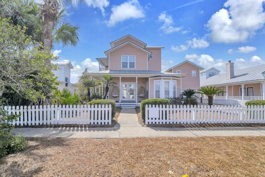 Welcome to Opal Beach House, a beautifully maintained 5-bedroom, 4.5-bath coastal retreat located in the desirable Crystal Beach Cottages community. Designed for both relaxation and strong rental performance, this exceptional property offers the ideal blend of comfort, style, and investment potential. The outdoor living space is truly a highlight. The private heated pool anchors a spacious backyard oasis, surrounded by expansive deck space that provides plenty of room for lounging, sunbathing, and outdoor dining. Whether hosting a group getaway or enjoying a peaceful evening swim, the layout accommodates both large gatherings and quiet moments. A covered patio bar area with mounted TV creates the ultimate outdoor entertainment zone. Perfect for game days, evening cocktails, or relaxing  poolside with your favorite show, this shaded space adds a resort-style feel that guests love. In addition to the home's private amenities, owners and guests also enjoy access to the Crystal Beach Cottages community pool, offering even more room to unwind. The property also features a separate carriage house, providing added privacy and flexibility. The carriage house includes a garage converted into a dedicated game area, delivering a fun, engaging space that enhances the guest experience and boosts rental appeal.Inside, the home offers spacious, well-appointed living areas with stylish coastal finishes and a thoughtful floor plan that comfortably accommodates multiple families or groups. As a top self-managed rental producer, Opal Beach House has a proven history of impressive returns. With its standout outdoor entertaining spaces, desirable location, and guest-focused amenities, this property presents a rare opportunity to own a high-performing vacation home that doubles as your own private beach retreat.