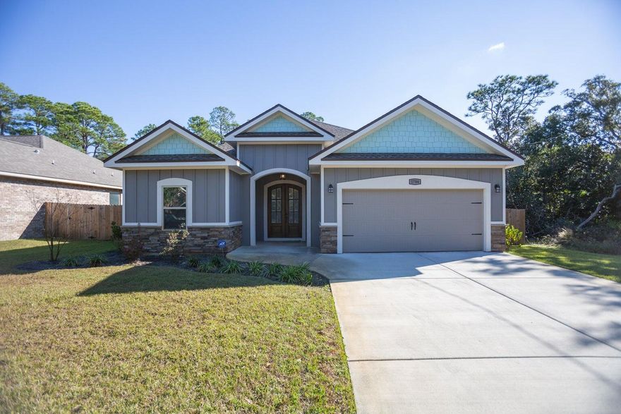 Come see this beautiful turnkey home in Navarre just minutes from the water. Built in 2017, enjoy modern features that have been meticulously maintained. Notice custom touches throughout such as cabinets, flooring, and counters. The open concept living area makes the perfect spot for hosting/entertaining. Step out back to enjoy a covered patio. Don't miss this one!