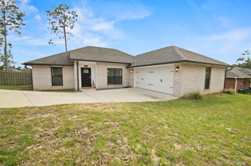 2.75% Assumable VA AND $10K towards closing costs makes this south Crestview home an attractive alternative to cookie cutter new construction. This beautiful 4 bed/2 bath home is south of Interstate 10 in Crestview in a family friendly neighborhood.  With easy access to I10, military bases, beaches and all the shops and restaurants in Crestview, this home is ready for a new family looking for location and style. The entire home is decorated in modern finishes from the new paint to the light fixtures and kitchen appliances. The large chef's kitchen is sure to please the most discerning cooks while the large open planned living area is perfect for hosting friends or for family evenings. The master suite features a large room and bath with dual vanities, soaking tub and separate shower.  The home has been redistricted to Antioch Elementary School and the washer & dryer convey. This home will not last, hurry and schedule your appointment to see today.