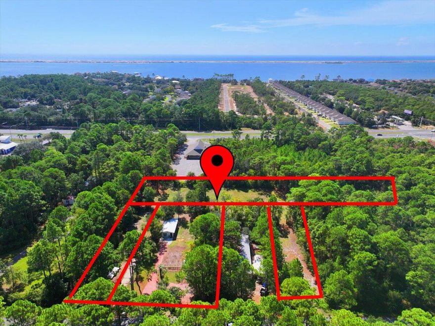 Oh, the potential with this unique bundle of three parcels in the heart of Navarre! This rare opportunity offers a mix of residential and commercial zoning, perfect for a wide variety of uses or future investment. The existing residence features a newer roof (within the past 4 years) and offers great versatility: live in it while you build, use it as a home office or business space, or clear it for new development. All three lots are cleared or partially cleared, giving you a head start on your vision.
The developed property is equipped with water and sewer, a small cottage and shed with a one-year-old roof. The larger commercial zoned lot includes a four-bay barn. There's an established apiary and Seller can offer mentoring on beekeeping to the buyers if desired.