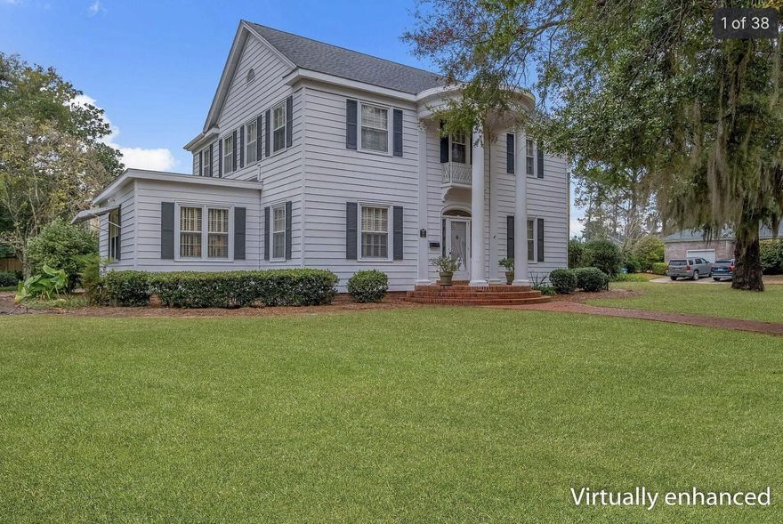 Timeless Colonial Revival in Historic Quincy! Built in 1938, this distinguished two-story home offers classic architecture and enduring elegance set amid a beautifully established landscape. With 4 spacious bedrooms and 4 Full bathrooms, the residence spans approximately 4,096 square feet and showcases beautiful hardwood floors. Gracious formal living and dining rooms provide the perfect setting for entertaining, while the large eat-in kitchen is ideal for everyday living. A bright and inviting sunroom adds extra living space and seamless connection to the outdoors. Rich in character and curb appeal, this exceptional property reflects the timeless beauty of one of Quincy's most cherished historic homes.