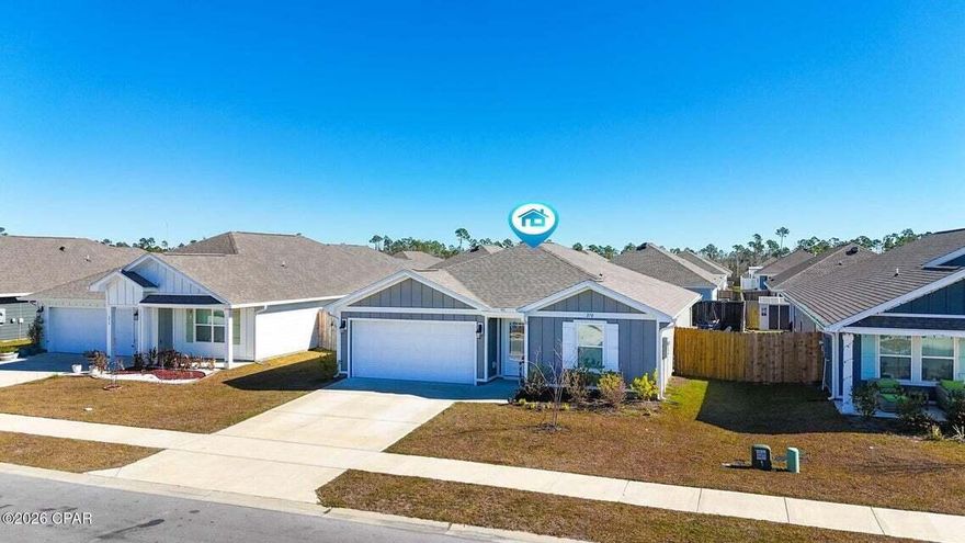 Reduced nearly 5k...this beauty is only 2 yrs. old.  Priced to sell, don't let this one get away!!  Located in Park Place in Panama City FL, this 4-bedroom, 2-bath Freeport floorplan offers 1,387 square feet of well-designed living space in one of the closest new construction communities to Tyndall Air Force Base. The welcoming entry opens into a bright, open-concept layout ideal for everyday living and entertaining.

The kitchen features a large center island and granite countertops throughout the home, with clear sightlines to the dining and living areas. A split-bedroom design provides privacy, with two bedrooms and a full bathroom at the front of the home and an additional bedroom off the entry hallway.

Main living areas, bathrooms, and laundry room are finished with luxury vinyl plank flooring, while the bedrooms feature carpeting. The primary suite includes a spacious bedroom and an en-suite bathroom with a double vanity, oversized shower, and large walk-in closet.

Exterior features include a brand-new privacy fence with integrated LED lighting and a backyard with ample space. Residents enjoy access to a beautiful community pool maintained by the low cost HOA. Conveniently located near shopping, parks, and schools, with easy access to Tyndall Air Force Base. Low HOA fees, billed quarterly, add to the home's overall value.

Schedule your private showing today and see why this home is the perfect place to make your next move.