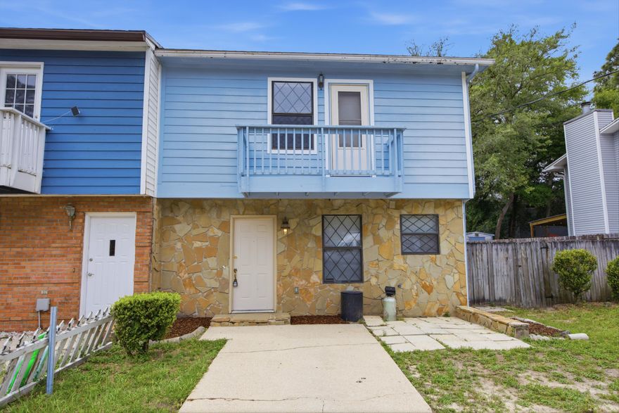 Located between Eglin Air Force Base and Hurlburt Field, this updated corner-unit townhouse offers convenience to military bases, schools, shopping, dining, the airport, and the white sand beaches of the Emerald Coast. The layout includes a half bath downstairs and a full bathroom for each bedroom upstairs, creating a practical setup for shared living while still offering privacy. The primary bedroom features a private walkout balcony. As a corner unit, the property has an extended fenced backyard with additional space for a storage shed, garden, or outdoor recreation area. Ideal for owners needing extra outdoor space for pets or entertaining. Major systems information and insurance quotes are available through the listing agent.