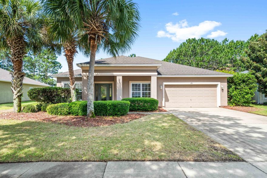 4BR/2.5BA ranch home in Palmetto Trace with pond frontage, community pool access, and a convenient Panama City Beach location near shopping, dining, and the beach. Built in 2006, this single-level home offers approximately 2,425 square feet under roof with an open living area, tile flooring throughout with carpted bedrooms, crown molding, 9 foot ceilings, and abundant natural light. Carpet just replaced in the bedroom staged as an office. The kitchen features a breakfast bar, pantry, and included appliances. The primary suite includes a walk-in closet and double vanity bath. Enjoy a covered patio, spacious backyard with pond views, and a 2-car attached garage. Palmetto Trace amenities include a community pool and sidewalks throughout the neighborhood.