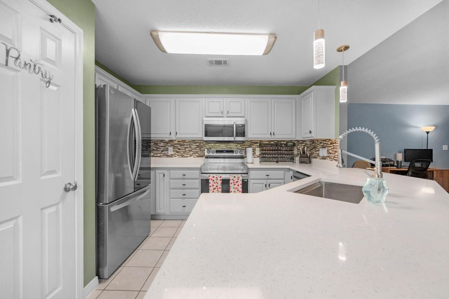 Welcome home to the perfect blend of contemporary style and functional living at 114 Conquest Ave. This meticulously maintained 4-bedroom, 2-bathroom w/ RV PAD home offers over 2,000 square feet of thoughtfully upgraded space, designed for those who appreciate both aesthetics and peace of mind. Step into a light-filled kitchen that serves as the heart of the home, featuring brand-new quartz countertops, a deep farmhouse sink, and upgraded pendant lighting. The modern, earthy-grey cabinetry is complemented by newer stainless steel appliances, making the space feel fresh and sophisticated. The upgrades extend far beyond the cosmetics. With a roof and HVAC both updated in 2020, and a septic system recently serviced for years of worry-free use, this home is truly turn key. Outdoor enthusiasts will find their joy here: a fully functional RV parking pad with power hookups, and two standalone sheds; one fully wired for a workshop or hobby space! End your days on the beautiful attached covered backyard patio. Whether you're enjoying the afternoon breeze or watching a Florida thunderstorm from the comfort of your hanging swing bench under the roof covering, this outdoor retreat is the ultimate spot to unwind. Book your showing today for a home that does truly have it all.