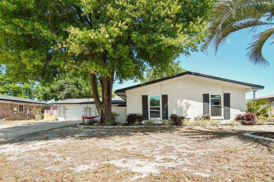 Beautifully updated 1652 square foot brick home in the heart of Niceville. This home features a brand new  roof, AC unit, kitchen with stainless steel appliances, new flooring and bathrooms. The new master bathroom has a large custom tiled shower. The wiring has been updated too. All new windows ands doors. The kitchen opens to a large dining area and living room with fireplace. The home has an additional living area and is perfect for entertaining. This move-in ready home has everything you've been looking for. The home has a large garage and courtyard in the front. The huge back yard has a built in fire pit and covered porch. This is ready for you!!!!