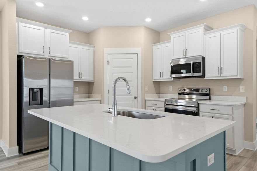 Seller paying 7,000 in closing cost/rate buy down. Freshly painted 3/2 in South Crestview and offers stylish updates throughout. The interior features fresh paint, a designer feature wall in the office, and a beautifully painted kitchen island that adds a custom touch to the heart of the home. The open kitchen is perfect for entertaining with white 42'' cabinets, quartz countertops, a breakfast bar, stainless steel appliances, and a spacious pantry. Laminate flooring throughout the main living areas makes the home both attractive and easy to maintain. The primary suite includes a large walk-in closet, en suite bath with a double vanity, a soaking tub, and a separate shower. The dedicated home office provides the perfect work-from-home setup. EV Car Charger