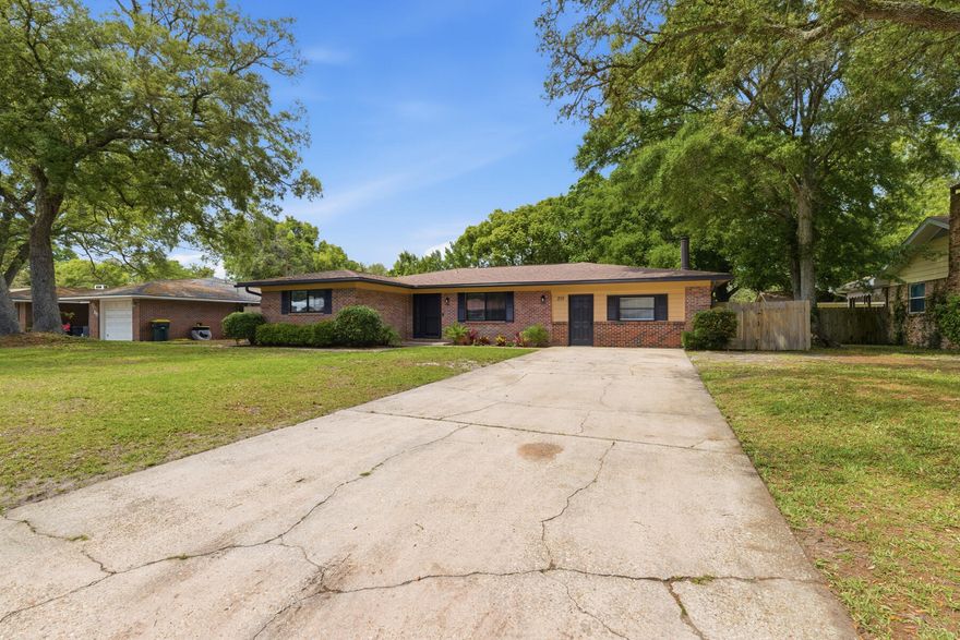 Welcome to 215 Sotir Street, a beautifully maintained home in a convenient Fort Walton Beach location. The home offers a thoughtfully designed floor plan featuring a 3 bedroom and 2 bathroom layout , offering 2,146 sq. ft. The main living room provides ample space for relaxing, with the adjoining family area with newly painted beadboard paneling. Along with its spacious dining room, it offers a working fireplace, perfect for cozy evenings. The kitchen features generous cabinet storage, additionally brand new kitchen appliances, with tiled backsplash. The 3 bedrooms offer comfortable layouts with generous closet space, while the 2 bathrooms are well-appointed for functionality, with a REMODELED MASTER BATH!
Outside is a large backyard area with a covered patio area.