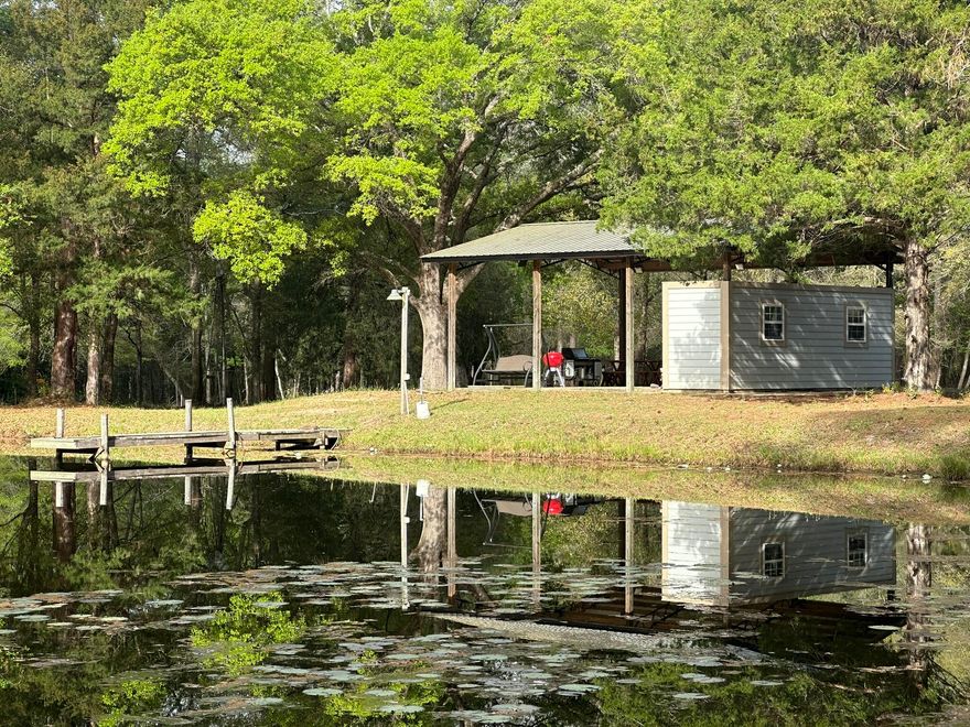 A rare opportunity to create a true showpiece estate, this property is positioned for a high-value homesite with exceptional long-term potential. Three private ponds create a striking waterfront setting stocked with pet fish galore, delivering both visual appeal and recreational use. Existing power and water, along with a pole barn and pavilion, provide immediate functionality and support future expansion. A Pavillion allows for immediate use while planning a larger residence or RV. The layout supports flexibility, including the potential for a minor land division. Positioned in a growing area with shopping, airports, Eglin AFB, and Gulf Coast beaches within reach, this property offers presence, versatility, and lasting value. Agents must be present for showings.