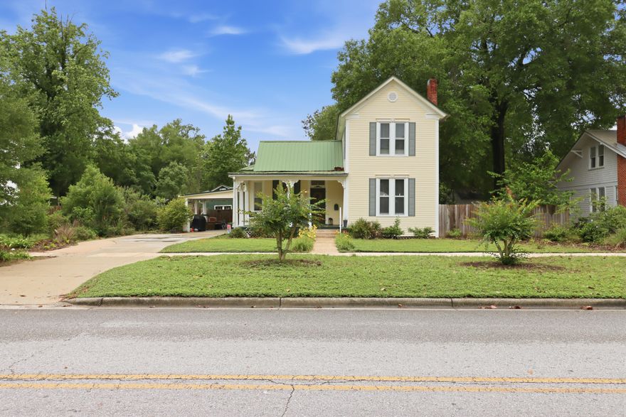 Step into a piece of history in the heart of DeFuniak Springs, where timeless character and Southern charm come together in this beautifully preserved historic home. Nestled beneath mature trees, this inviting property offers the perfect blend of warmth, charm, and classic craftsmanship. Located just moments from the iconic lake yard, local coffee shops, boutique shopping, and downtown favorites, this home captures the essence of true small-town living while offering the character and atmosphere that make historic homes so special.
A versatile bonus room connected to the home offers endless possibilities and could easily serve as an art studio, butler's pantry, home office, reading room, or creative space. Outside, a detached storage building adds even more opportunity and could be transformed into a gardening shed, workshop, hobby space, or potential mother-in-law suite. Situated on an oversized lot with a fully fenced backyard, this property provides the space, flexibility, and charm to truly make it your own.