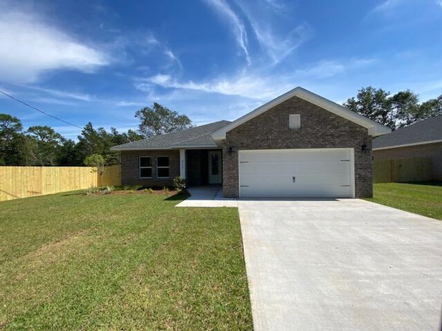 Step into effortless living with this stunning all-brick home ideally located just minutes from local bases, beautiful beaches, and everyday shopping. Designed with both style and functionality in mind, this home showcases high-end finishes and thoughtful upgrades throughout.

Inside, you'll find an upgraded entryway with a shoe bench and coat rack. Wood-look tile flooring flowing seamlessly through the main living areas - including the foyer, kitchen, bathrooms, and laundry room, offering both durability and modern appeal. The living room is elevated by a stylish alcove ceiling, creating added height and an open, inviting atmosphere.

The tucked-away kitchen is a true standout! Bright, modern and perfect for entertaining. It features quartz countertops, crisp white cabinetry, soft-close drawers, and a spacious breakfast bar accented with decorative pendant lighting, making it ideal for casual dining or hosting guests.

The primary suite offers a relaxing retreat with a generously sized bedroom and a beautifully appointed en-suite bathroom. Indulge in the comfort of dual walk-in closets, a tiled walk-in shower, and a separate soaking tub, perfect for relaxing after a long day.

Enjoy added convenience with a dedicated laundry room featuring a folding table for extra workspace, plus direct access to a spacious two-car garage.

Step outside to a covered back porch, ideal for relaxing or entertaining overlooking a fully fenced backyard that wraps around the home and features a convenient access gate. This property offers everything you need. Don't miss your opportunity to make it yours. Contact us today for a showing!
