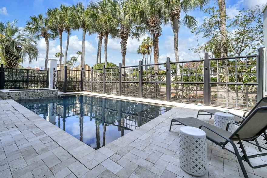 REO:  Welcome to your dream beach retreat in the highly sought-after, gated community of Destiny East sits This beautifully renovated villa sits on a corner lot which offers privacy and plenty room for everyone. Villa comfortably sleeps 20 and was designed with entertaining and luxury coastal living in mind. Short-term rentals ok! 
The main residence features five spacious bedrooms, including three primary suites with private ensuite baths, offering comfort and privacy for family and guests alike. A second-floor bunk room and an oversized third-floor bunk room with adjoining den and charming spiral staircase create the perfect gathering spaces for kids and guests. 
At the heart of the home, the huge gourmet eat-in kitchen impresses with a granite island, tile backsplash, and abundant space for hosting. Multiple living and entertaining areas flow seamlessly to the outdoors, where you'll find two enormous covered porches, lush landscaping, extensive outdoor lighting, and a private resort-style setting.
Step outside to your own backyard oasis featuring a heated private pool, hot tub, and expansive grilling area--perfect for relaxing after a day at the beach. Additional highlights include a full-house generator, on-demand water heater, new roof (2023), 2-car garage, and thoughtful upgrades throughout.
Above the garage is a separate apartment-detached carriage house provides additional flexibility--ideal for guests, in-laws, or rental potential. Carriage home is complete with a full kitchen, a living room and a separate bedroom.
Destiny East amenities include a deeded beach access, lagoon-style community pool, Destiny East Clubhouse,  tennis/pickleball courts, a putting green, playground, fitness center.  Close to several outstanding restaurants, and local attractions. This exceptional property offers the ultimate combination of location, luxury, and space--perfect as a primary residence, second home, or high-performing vacation rental in one of Destin's most desirable communities