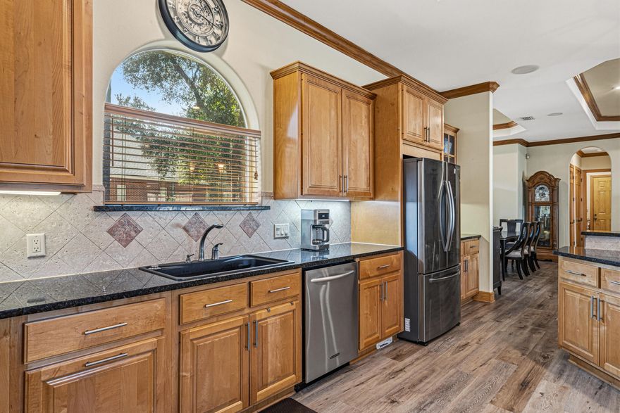 Multi-generational space!

CUSTOM HOME! New roof, HVAC, TWO brand new water heaters, LVP flooring, trayed ceilings, recessed lighting, surround sound & gorgeous custom woodwork throughout!

With nearby access to beautiful parks, sidewalks, top-rated schools, access to an Olympic style pool & clubhouse, golf, vibrant shopping, dining options, the expansive layout features high ceilings, elegant finishes, 10-foot doors, and a seamless flow between living spaces. It's definitely a lifestyle!

All bedrooms face the pool courtyard with a convenient entrance for each room.

A highlight of this home is the charming, detached guest suite with a kitchenette providing a private retreat for visitors or the perfect space for an office or a teenager wanting a little independence.

 It's a must see! This home is in a highly desirable neighborhood with plenty of bike riders and dogwalkers, you'll love it!