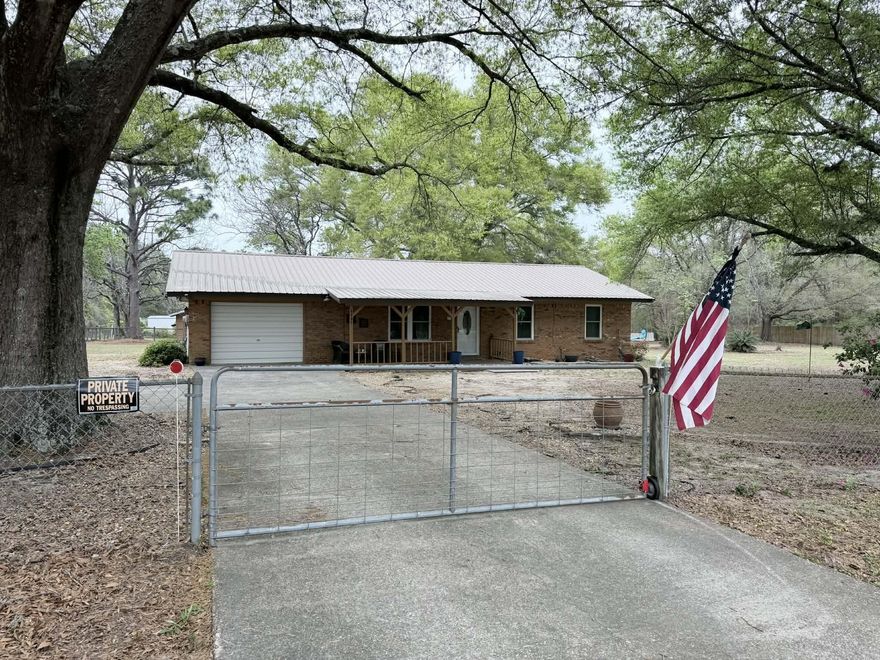 Bring your horse to this beautiful country home that is in a great location.  It is south of the interstate on Coy Burgess Loop so you are close to Freeport and the beaches.  This beautiful brick home with a metal roof has 3 bedrooms 2.5 bathrooms, garage, and large sun room overlooking the back yard.  The yard is fully fenced with two horse paddocks, run in shed, and a building with water and electricity and a horse stall. The property is bordered by 3 roads so you only have one neighbor in the backyard.