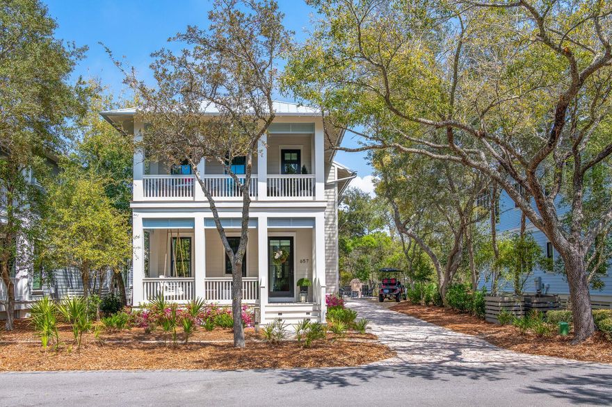 The newest home in Phase 1 of WaterColor, 657 Western Lake Drive offers a rare opportunity to own what essentially lives as a brand-new home in the most established and sought-after section of the community. Completed in January 2025 following a comprehensive top-to-bottom rebuild, every aspect of the home has been thoughtfully redesigned and reconstructed with high-quality materials, modern systems, and refined coastal finishes--creating a residence that feels entirely new in the heart of original WaterColor.

Perfectly positioned overlooking Western Lake and directly along the WaterColor walking trails, the home places you in the center of the community's most iconic amenities. Cerulean Park, the LakeHouse, Boathouse, and Marina Pool are just steps away, while the WaterColor Beach Club,  Gulf-front pools, the beach, the WaterColor Inn, and the shops and restaurants along 30A are all conveniently nearby. Tennis and pickleball courts, the future fitness center, Camp WaterColor, and the Frog Pool are also easily accessible, while the boutiques and dining of Seaside are just a short bike ride away along the scenic 30A path, or a quick walk down the "secret path".

The nearly 3,100-square-foot home offers four bedrooms and four-and-a-half bathrooms, along with four covered decks designed to capture views of Western Lake and the surrounding natural landscape. Two screened rear decks connect seamlessly to the living room and primary suite through folding-glass doors, expanding both spaces and creating an exceptional indoor-outdoor living experience.

Inside, the home showcases elevated craftsmanship throughout, including white oak hardwood flooring, custom white oak staircases and ceiling treatments, vaulted ceilings with exposed beams, and detailed nickel-gap shiplap and board-and-batten walls. Gas fireplaces anchor both the living room--finished in Venetian plaster--and the primary suite, which features a beautifully designed vaulted ceiling with white oak beam detailing.

The chef's kitchen is designed for both everyday living and entertaining, featuring custom cabinetry by Grimes Cabinets, a walk-in pantry with built-in white oak wine storage, and a fully panelized Thermador appliance suite including a 36-inch six-burner gas range, double ovens, a 42-inch refrigerator, wine refrigerator, dishwasher, and four refrigerated drawers.

Additional upgrades include all-new electrical, plumbing, and HVAC systems with two Bosch units, spray foam insulation, a tankless water heater, and Marvin Ultimate StormPlus hurricane-rated windows and doors. Exterior improvements include HardiePlank siding, a standing seam metal roof, Ipe decking across the covered porches, a paver driveway, new landscaping and irrigation, a gas fire pit, outdoor grill station, and dedicated golf cart parking with a charging station.

With its rare "like-new" rebuild, exceptional craftsmanship, and premier Phase 1 location near WaterColor's most sought-after amenities, this home offers an extraordinary opportunity to experience the very best of the WaterColor lifestyle.