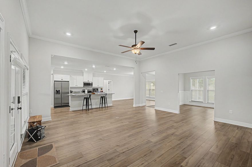 2022 Truland-built Berryhill floor plan featuring 4BR/3.5BA + flex room and 2-car garage, meticulously upgraded and maintained throughout. Open-concept split floor plan seamlessly connects kitchen, dining, and living areas. Kitchen offers granite countertops, gas stove, oversized eat-up island, added cabinetry, and serving area.



Private primary suite features oversized bath with double vanity, tiled walk-in shower, semi-custom closet, and walk-through laundry with wash tub. Additional bedrooms are generously sized, including one with private en suite.



Features include ceiling heights up to 11', luxury vinyl plank flooring, crown moulding throughout living areas, picture frame wainscoting in flex room, granite throughout, tankless water heater, oversized covered back porch plus front covered porch overlooking green space, hurricane protection, sprinkler system, gutters, and remote-controlled ceiling fans throughout, including all bedrooms -- all steps from neighborhood amenities.



Located in desirable Yellow River Ranch with abundant green space, natural beauty, community pool, playground, basketball, pickleball, and tennis courts. Convenient to I-10, Pensacola, Whiting Field, Eglin AFB, Pensacola Beach, and Navarre Beach.