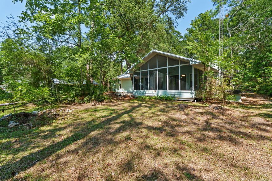 Waterfront living meets functionality and freedom at this exceptional property on Mallet Bayou Road in Freeport. Situated on beautiful Mallet Bayou with approximately 100 feet of water frontage, this property offers direct access to boating, fishing, kayaking, and enjoying the natural beauty of the bayou right from your backyard, with convenient access to Choctawhatchee Bay and the Intracoastal Waterway.

Designed for both comfort and versatility, the property features a private dock with four slips and a boat lift capable of lifting up to 3,000 lbs, making it ideal for boating and waterfront recreation. A spacious screened porch overlooks the water and provides the perfect setting for outdoor dining, entertaining, or simply taking in the peaceful views.

The home includes a wood-burning fireplace, double pane windows, foam insulation in the attic, and durable Hardie board siding. A new metal roof installed in 2024 adds long-term value and peace of mind.

In addition to the attached 2-car garage, the property offers extensive additional storage and workspace options including a detached garage/workshop, RV pole barn, carport, greenhouse, and mower shed. With no HOA and unrestricted use, the property provides flexibility for a variety of uses.

Conveniently located near Freeport amenities, marinas, dining, and the beaches of South Walton, this waterfront property combines coastal access, usable space, and practical improvements in a unique bayou-front setting.