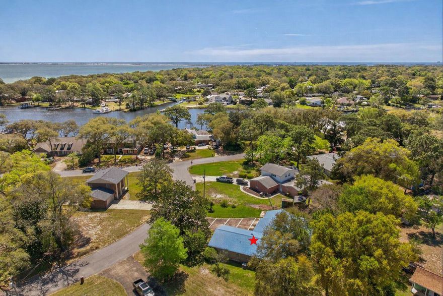 This vintage, 4BR/2BA gem is located in the heart of Elliott Point, just minutes from Fort Walton Yacht Club, Cinco Bayou, downtown Fort Walton Beach, Ferry Park, shopping, restarants, white, sugary, sand beaches & tourist hotspots! This property has been in the same family for almost 30 years!  Highlights include a light kitchen remodel, metal roof, sprawling 0.34A lot, deep one-car garage, screened porch, outdoor workshop with electricity, bay window overlooking the backyard, beautiful parquet flooring, vintage bathroom tile, fenced backyard and spacious square footage. Large den area features a gas fireplace with access to the screened porch!  Breakfast nook is nestled within the Bay Window!  This ranch home features a stall shower in the Primary Bath that is perfect for aging in place!