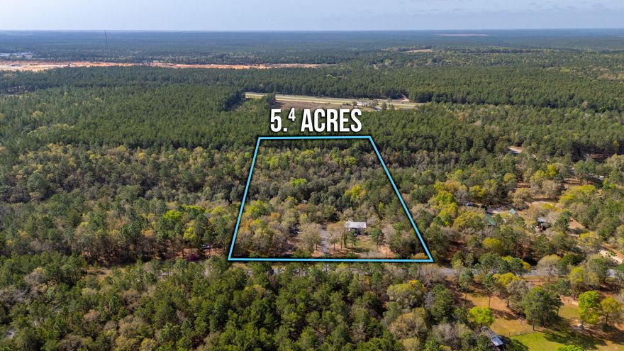 Nestled in the heart of the Florida Panhandle, this sprawling 5.4-acre ranch at 248 Elmwood Road offers the ultimate turn-key setup for those seeking a private, high-end basecamp. This isn't just raw land; it is a fully functional, 'plug-and-play' estate featuring a massive, over-height steel pole barn on a stabilized gravel pad with power and a dedicated RV plug ready for immediate use. The property is thoughtfully improved with a custom-built workshop/cabin that boasts blown-in foam insulation, a dedicated heating and AC unit, and a beautiful porch. A sturdy elevated boardwalk and professional contoured landscaping with retaining walls enhance the natural beauty of the site. The land itself is a rare find, featuring a stunning spring-fed creek with crystal-clear water running directly through the property. Surrounded by a dense canopy of natural timber, you will enjoy total privacy and a true Florida ranch atmosphere, all while benefiting from modern infrastructure including an installed septic tank and city water. The location is a dream for outdoorsmen, situated just minutes from the legendary fishing of the River and the pristine waters of the Bay. Whether you are tracking deer in nearby management areas or looking for a permanent homesite for a mobile home, the hard work of clearing and utility installation is already finished. This DeFuniak Springs gem is ready for you to pull in, plug in, and start enjoying the quiet peace of the North Florida wilderness today.