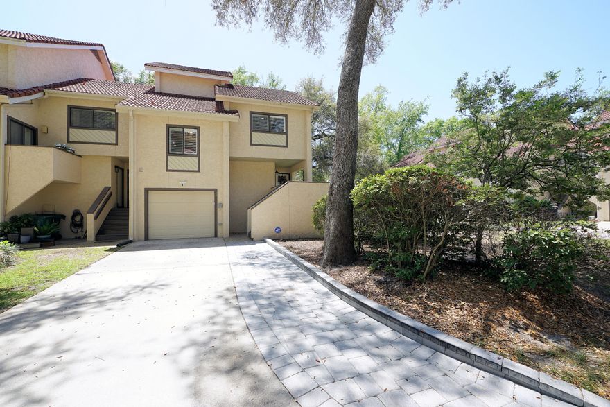 Seller offering $7,000 toward buyer's closing costs--don't miss this opportunity! Updated 2BR/2.5BA townhome in sought-after Bluewater Bay Marina, offering a relaxed coastal lifestyle with great amenities nearby. Entry-level living room features vaulted ceilings, a wood-burning fireplace, and opens to a 14'x6' deck overlooking a peaceful wooded area. Second level includes an updated kitchen with granite countertops, dining area, and a bright office space. Third level offers a bedroom suite with private bath and loft. Top-level primary suite provides privacy and a well-appointed en-suite. Ample storage throughout plus convenient multi-level layout ideal for full-time living or a weekend retreat. Close to marina, golf, dining, and beaches. Move-in ready and waiting for you. Call today! Now.