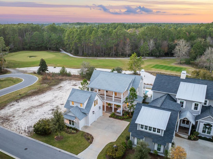 Set along the Watersound Origins Golf Course on a quiet cul-de-sac, this 2023 build delivers what new construction at this price point can't: a fully built-out home with finishes, systems, and outdoor living already in place - and a buyer who can move in this season instead of waiting two years to break ground.

Inside, the home was designed around how people actually live. The kitchen anchors the main living area with a large marble island wrapped in white oak, Sub-Zero refrigeration, a dual Wolf range with both gas and electric cooking, and a built-in 30-inch Wolf coffee station. Just off the kitchen, a white oak wine bar adds a wine cooler, nugget ice maker, and unlacquered brass fixtures with real character. 
Throughout the home, finishes were chosen with consistency and durability in mind - Carrara marble bathrooms with custom tile, true masonry fireplaces (including a custom stone fireplace centering the main living room), wide-plank wood floors, a sliding glass wall opening to the lanai, custom stair runner, and California Closets in key bedrooms.
The outdoor living area was built to function as a true extension of the interior and to be used year-round. A private pool with raised hot tub sits off a covered lanai outfitted with automated screens, Cumaru hardwood decking, built-in electric heaters, integrated speakers, an outdoor kitchen with Artisan grill and refrigeration, and a second masonry fireplace.
A detached carriage house above the garage adds a fifth bedroom with its own full bath - ideal for guests, in-laws, or a long-stay home office, and the kind of layout flexibility most floor plans in this price band don't offer.
Behind the scenes, the home is set up to run cleanly. A 26-kilowatt Generac generator services the entire residence and carriage house. Sonos audio is wired throughout and controlled via dedicated iPads, Samsung Frame televisions are installed across multiple rooms, a full security system with day-night cameras is in place, and Wi-Fi-enabled garage doors include a dedicated golf cart bay. Outside, extensive landscaping, low-voltage lighting, and a Wi-Fi irrigation system frame the home and golf course setting.
Watersound Origins remains the most practical community on this side of 30A for full-time residents - close to the Origins Club, walking trails, the Watersound Town Center, Publix, and zoned to South Walton schools.
Most homes in Origins have one or two standout features. This one combines several: real golf course frontage, a fully built-out outdoor living space, a detached carriage house, and a depth of systems already paid for and installed. For a buyer weighing this against starting fresh, the math and the timeline both favor the home that's already done.