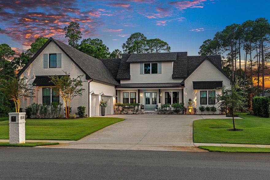 Showings begin 4/15/26. Coastal elegance meets everyday comfort in this stunning 5-bedroom, 4.5-bath custom home by Cogent Building Group and Bird Dog Design Co. Thoughtfully curated for a growing family, this home also features a private office, separate media/living room, and expansive 3-car garage. Enjoy bay views from the front porch and relax in the 40' gunite pool with sun ledge and pool heater, situated on over 1/2 an acre. Interior highlights include 10' ceilings, vaulted living and primary bedrooms with white oak beams, engineered hardwood flooring, designer lighting, and custom window treatments. The chef's kitchen is equipped with quartzite countertops, Thermador gas cooktop, soft-close wood cabinetry, and a filtered drinking water system...