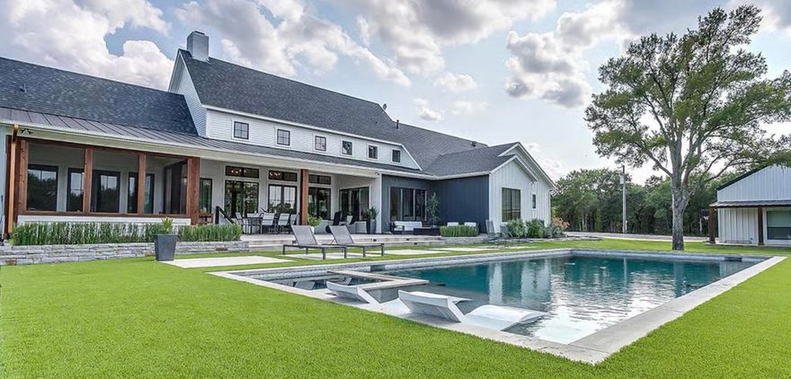 Beautiful new modern farmhouse on 40 acres, scheduled for completion Q1 2027, with adjacent orchard views and room to create the lifestyle you've been looking for. You still have time to personalize select finishes, including roof color, exterior paint and window grid colors, cabinet color, appliances, fixtures, flooring, and tile. This thoughtfully designed 4 bedroom home will feature a spacious game room, screened porch, and 2 car garage, along with driveway parking for 4 additional vehicles. Set on a picturesque 40-acre parcel, the property offers space for gardening, horses, livestock, and outdoor living. The setting combines privacy, open land and trees, sweeping sunset views. Rare opportunity to own a new Modern Farmhouse on a large parcel close to the New Town Center and restaurants