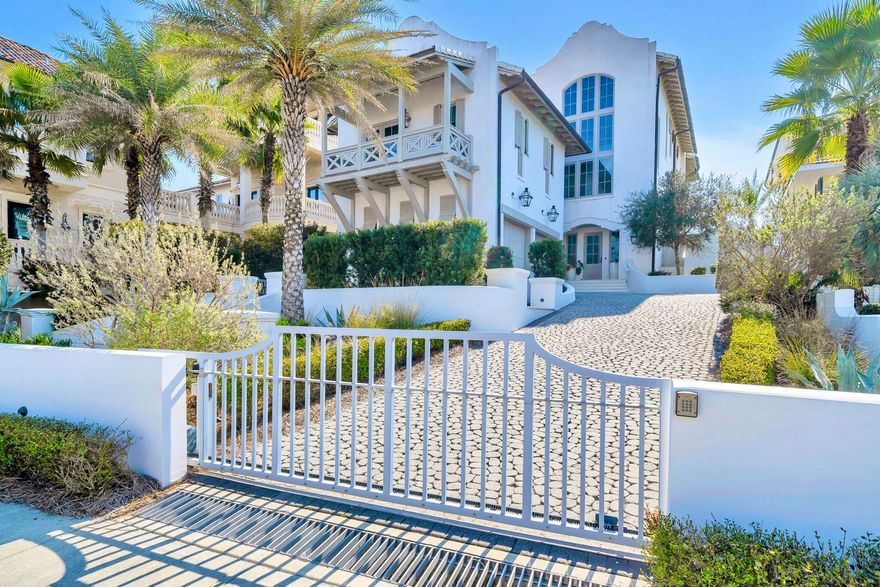Awash in natural light, this ethereally elegant beachfront Carillon Beach home, appropriately named Halcyon Days, seems to shape-shift with moods of the sea and sky. Walls of windows and large porches facing the Gulf of Mexico allow light to dance upon the home's textured layers, soft wood tones and natural stone elements. 

''The expansive view of the Gulf from every south-facing window will stop you in your tracks,'' says Jonathan Hampel, the home's designer, and Principal Architect of acclaimed A BOHEME Design. Impressive visual features include mirrors reflecting the stunning southern light and panoramic coastal views with expansive natural wood beams accenting the ceilings, enhancing the cozy, welcoming atmosphere. The kitchen, and its custom-designed, oversized marble-top waterfall island with curved end, is the heart of Halcyon Days, and perfect for entertaining. In fact, it anchors the open-concept dining and kitchen space. 

The living room's lime-washed brick imparts warmth and rustic appeal, while the sloping curved lines of the fireplace mimic the home's architectural style inspired by West Indies and Cape Dutch influences. Special touches like curved Venetian plastered walls provide a soft reflective quality, contrasting with the visually spectacular ceiling oak wood beams. 

The master bedroom suite, accessible by elevator and spanning the entire top floor, embraces simple details incorporating the use of white with soft contrast accents in art, lighting and texture. The painted wood ceiling adds coastal elegance, complementing the master bath's pristine white marble and custom Italian fixtures. 

From the interior undulating acid-washed railings to the minute detail and patina of the exterior brass fountain fixtures naturally enhanced by the salt air mist, every element sets off the dipping pool/Jacuzzi and its sequestered view to the stunning emerald blue waters of the gulf. The home's architectural lines and details, coupled with its thoughtful, pragmatic design features, create a gathering/entertaining place where cherished generational memories are fostered. Halcyon Days was featured in an exclusive online and print edition article in the Wall Street Journal in February 2026 and, prior to that, in Birmingham Magazine beach issue.  The photos tell the story of thoughtfully planned design and unmatched, yet simple and captivating, elegance.