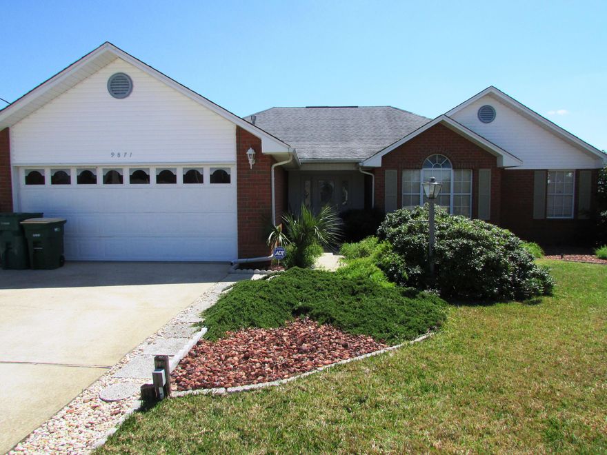 Amazing lakefront home in cul-de-sac! Enter the gorgeous leaded glass front door with leaded glass sidelights to the huge great room with a wood burning fireplace nestled between transom windows, a vaulted ceiling, recessed lighting, & French doors leading to the covered patio and the beautiful view of the lake. The kitchen has a breakfast bar, pantry and large dining area. The GE side by side refrigerator has a water/ice dispenser. The master bedroom narrows into a cozy sitting area that opens to the patio and has a walk-in closet. A glass block window over the jetted garden tub allows plenty of light into the master bath. Enjoy the free standing shower and the double sink vanity. Both sides of the home is fenced leading down to the lake. $2000 decorating allowance on full price offer! Save on your power bill with Energy Select. Also, the home has ADT Security System installed.