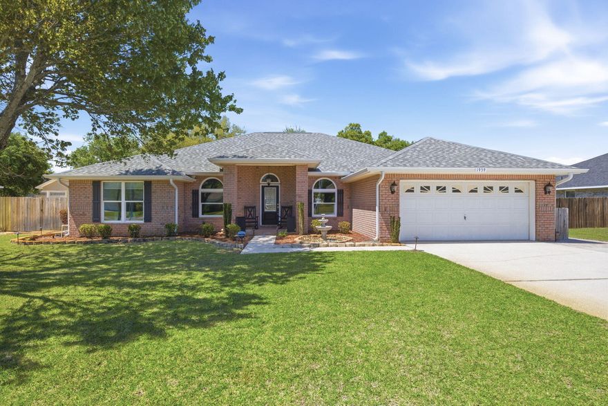 Welcome to this spacious and beautifully maintained and updated brick home nestled on almost half an acre in one of Navarre's most sought-after neighborhoods. Offering over 2,700 SqFt of living space - with 4 bedrooms, 3 full bathrooms, a gorgeous designated office with arched glass french doors, an expansive open concept main living space, an eat-in kitchen/breakfast nook, formal dining space, indoor laundry room, and more! Durable and beautiful wood-look tile flooring flows throughout the bedrooms and main living spaces, providing a modern aesthetic and easy maintenance. The kitchen features charming maple wood cabinets, an island with a new induction cooktop with downdraft vent, a KitchenAid wall oven and microwave combo, and granite countertops. The massive great room is accented by a a cozy, corner, wood-burning fireplace. Enjoy a split floor plan for added privacy. The primary suite boasts a tray ceiling and an oversized ensuite bathroom with walk-in shower, step-in tub, double vanity, and a walk-in closet. The remaining 3 bedrooms and 2 full bathrooms are on the opposite side of the home. Step outside the slider doors to the backyard Oasis - starting with a covered patio perfect for alfresco dining or relaxing in the shade taking in the views of the sparkling in-ground heated salt water pool - powered by natural gas. The backyard also includes a dedicated workshop and a storage shed. Enjoy peace of mind with all newer major systems - including a 2022 Roof, 2022 tankless gas water heater, and a 2024 HVAC and Air Scrubber. Ownership also grants you access to all the amenities Holley By The Sea has to offer - including a boat ramp, 8 clay tennis courts, a community event hall, 3 different pools, exercise room, and more! Schedule your showing today!