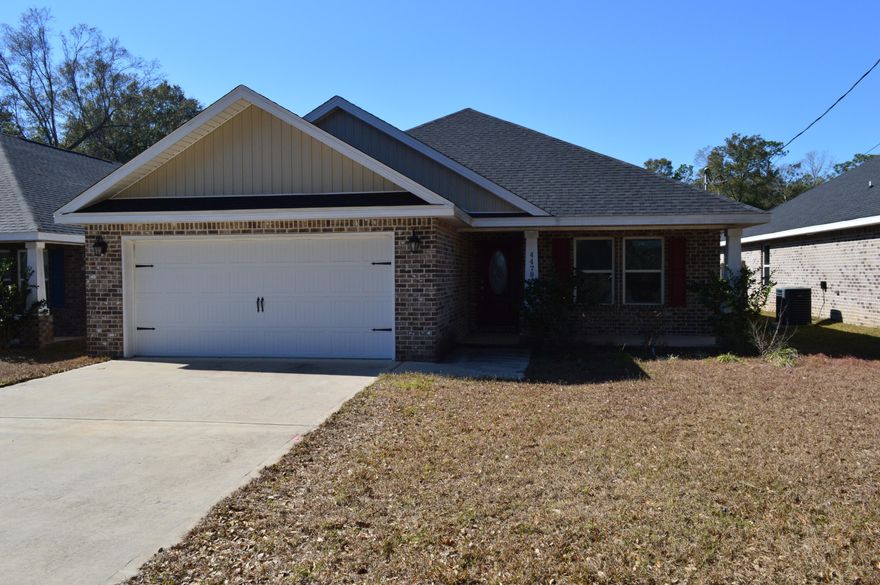 Only 3 1/2 years old and well kept in the heart of Pace!  This 3 bedroom 2 bath brick home offers exactly what you are looking for. Wide open living room, dining room and kitchen space lined with Luxury Vinyl Plank Flooring. This floor plan offers a spacious master suite, a luxurious master bathroom including a separate garden tub, a stand up tile shower & double vanities. The kitchen includes solid wood cabinets with soft close doors & drawers. 3cm Granite in kitchen and bathrooms. High end finishes include vaulted ceilings in the living room & a single trey ceiling in the master bedroom, brushed nickel fixtures, lever style door handles & more! Privacy fenced back yard.