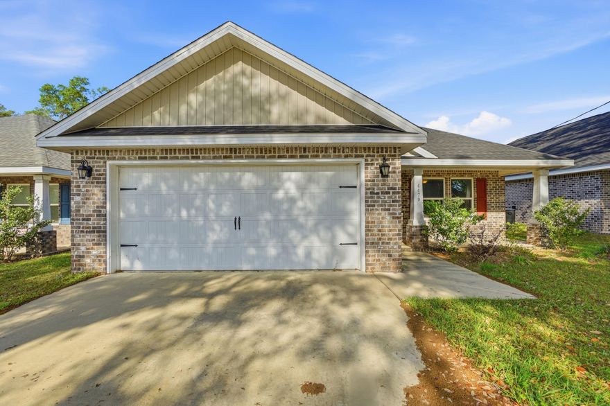 Only 3 1/2 years old and well kept in the heart of Pace!  This 3 bedroom 2 bath brick home offers exactly what you are looking for. Wide open living room, dining room and kitchen space lined with Luxury Vinyl Plank Flooring. This floor plan offers a spacious master suite, a luxurious master bathroom including a separate garden tub, a stand up tile shower & double vanities. The kitchen includes solid wood cabinets with soft close doors & drawers. 3cm Granite in kitchen and bathrooms. High end finishes include vaulted ceilings in the living room & a single trey ceiling in the master bedroom, brushed nickel fixtures, lever style door handles & more! Privacy fenced back yard.