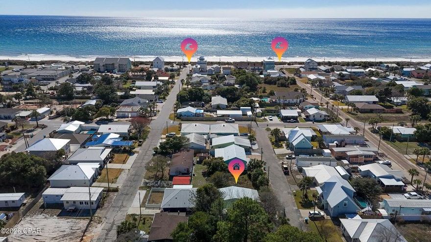 Welcome to 208 El Prado Place! Cute 2 bedroom Florida beach cottage on the West end of Panama City Beach. Located in Laguna Beach, only two blocks from the beautiful white sandy beach and emerald waters of the Gulf. Close to Pier Park and Top Golf to the East, and to the shops and restaurants along scenic 30-A to the West. It's just a short walk or golf cart ride to the dedicated Laguna Beach access points, and also to the Carousal Grocery Store and Thomas Donuts, popular with both locals and year round visitors.  
This cottage has an updated kitchen, all white cabinets, quartz countertops, ceramic sink, and appliances, including stove, refrigerator, built-in microwave and stackable washer and dryer. The Master Bedroom has a door that opens on to the back deck, and the updated Bathroom has a shower/tub combo. There is a large covered front porch that wraps around and extends along the length of the house. Perfect for sitting outside with your morning coffee, or for relaxing after a day  spent on the beach. There's a Meyer lemon tree in the front yard, and pink roses that grow along the white picket fence in the Spring and Summer. Driveway parking, plus extra parking space at the front of the property. Short term rentals allowed. No HOA. Don't miss the opportunity to make this your very own beach house, vacation cottage or rental investment property! ** Please note - The floors need to be replaced in this home.