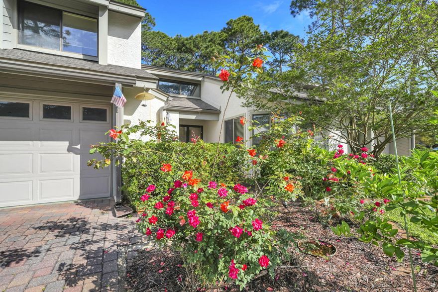Located in the heart of Bluewater Bay, these highly sought-after Gleneagles townhomes are known for generous floor plans, walkable surroundings, and excellent value with low HOA fees. This residence offers approximately 2,000 square feet of thoughtfully designed living space that balances comfort and flexibility with an active coastal lifestyle. The main level features a dramatic, oversized living room with a gas fireplace, an adjoining formal dining area, and an updated kitchen equipped with quartz countertops and stainless steel appliances. An enclosed garden room opens to a covered patio and private gardens.  For added convenience, the primary suite and a guest half-bath are also located on the first floor, which features wood plank tile flooring throughout. The second floor includes two large bedrooms and a full bath. The rear bedroom features an additional sunlit reading room or studio area. Residents enjoy an impressive array of amenities, including community pools, a tennis and pickle ball center, walking trails, and a playground. The lifestyle is further enhanced by a championship golf course, clubhouse dining at the Blue Tee Restaurant, and a marina featuring a sailing club, Freedom Boat Club, a sandy beach and the LJ Schooner's Restaurant & Bar.  With its well-maintained surroundings and strong community appeal, this property represents an exceptional opportunity.