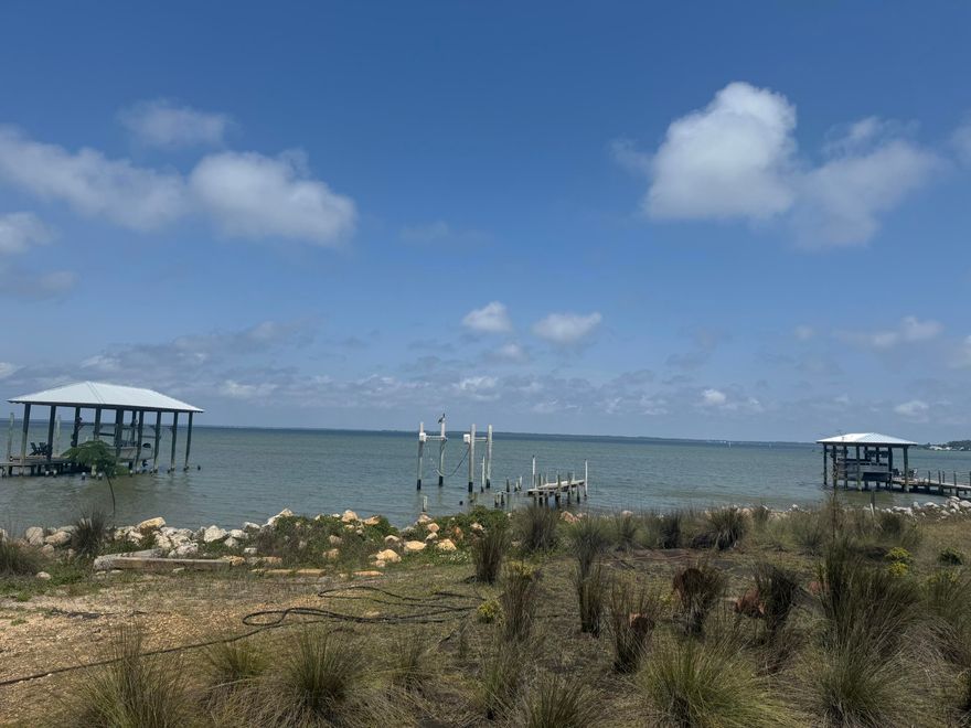 Exceptional opportunity to own a vacant, level bayfront lot in the highly desirable Turquoise Beach community of Santa Rosa Beach. This homesite offers stunning, unobstructed water views and the perfect setting to build your custom coastal retreat. The seawall has been reinforced in recent years with durable granite rip rap, providing added protection and long-term peace of mind. Architect-designed house plans, created specifically for this homesite, are available--making it even easier to bring your vision to life. No HOA, offering added flexibility and freedom. Enjoy tranquil surroundings, breathtaking sunsets, and direct bay access in one of the area's most sought-after locations.