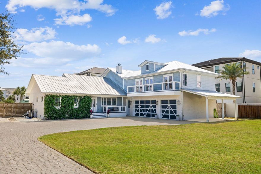 Situated just three blocks from the sand, 40 Louva Lane occupies a rare 0.50-acre parcel just above Gulf Place, making dining, shopping, and beach access within easy walking distance. This lot size is incredibly hard to find in this corridor, particularly with no HOA and no restrictions. 

The home sits toward the back of the site, giving a feeling of privacy and seclusion. A long brick paver driveway leads to the courtyard entry and offers ample parking. 

In total, the home offers 2,703 square feet, four bedrooms, three-and-a-half bathrooms, multiple porches, a resort-style pool, a 3.5-car garage, and a carport. The fully landscaped front and back yards, including podocarpus, jasmine vines, palms, palmettos, and lots of sod, create a true oasis. Gas lanterns line the garage and the front and rear porches have wood-paneled ceilings. 

The exterior was converted from stucco to Hardie Board and brick during the 2019-2020 renovation, a full-scale remodel that touched virtually every surface, system, and finish inside and outside the home. 

Inside, a welcoming foyer connects the living, dining, kitchen, and bar areas designed for both everyday living and effortless entertaining. The bar is equipped with an ice maker, wine fridge, and glass-paneled cabinets. The kitchen features a gas range. All appliances, cabinetry, countertops, and backsplash were replaced in the renovation. A wood-burning fireplace with a custom pecky cypress mantel anchors the living room, and shiplap accents throughout the home reinforce the coastal character. 

The primary suite is on the main level and features an ensuite bath and dual closets. The half bath and laundry are also on the first floor, creating a true single-story living experience, leaving the upstairs as a guest space.

Upstairs, the second living room and game area serve as another large gathering space, with access to a balcony overlooking the front yard. The sleeping quarters are smartly arranged: two bedrooms share a Jack-and-Jill bath, while a third bedroom and bunkroom share a hall bath. 

Mechanically, the home was rebuilt from the inside out. Spray foam insulation was installed throughout the walls and attic; all windows and doors were replaced; the majority of the sheetrock was replaced; and all flooring, lighting, and plumbing fixtures were replaced. 

The backyard delivers on every level. Enclosed by a six-foot concrete privacy fence, the outdoor living space centers on a pool with a sun shelf, splash pad, integrated hot tub with spillover, and a built-in basketball hoop, all surrounded by white natural stone pavers and palms. The rear screened porch was expanded to double its original size during the renovation and features motorized screens that open the porch to the yard and pool. 

Lastly, the three-and-a-half car garage is deep enough for your Suburban and offers all the additional storage you could imagine. Fully furnished and genuinely turnkey, 40 Louva Lane is the rare property that delivers the quintessential beach home you've been looking for.
2000 Year Built is based on Walton County PA Effective Year Built