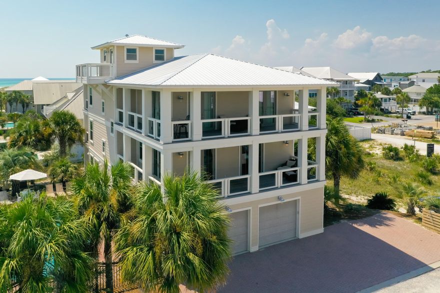 Location, Location, Location! Gulf-view renovated 4-story beach home in Grayton Beach. This 2nd-tier property features 7BR/7BA, a 3-car garage, private elevator, and a large private pool on an oversized 100' x 100' lot, located approximately 100 feet to beach access. Adjacent to Grayton Beach State Park with a county-maintained public beach (no customary use concerns). Strong rental potential and ideal as a primary residence, second home, or investment property. Recent renovations include New Cumaru decking, columns, and railings; updated exterior lighting and door hardware; interior upgrades with Hickory hardwood flooring throughout featuring Bona Oyster stain finish. Interior features: Multiple living areas, spacious bedrooms, en-suite baths and an elevator for easy access! There is abundant natural light and Gulf views from the upper levels. Exterior features: Oversized lot, private pool, multiple decks/balconies, 3-car garage, ample parking, and proximity to the beach walkover. Location: Centrally located in Grayton Beach--walk or bike to restaurants, shopping, and local attractions. Sold fully furnished and turnkey ready.