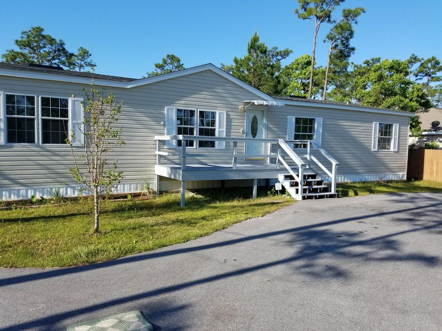 Great price for the location!!!  Nice Double wide MH in a fantastic location in highly desirable Santa Rosa Beach, close to the Sacred Heart Hospital complex, beach and state park. Lot backs up to state forest. Property has deeded water access to Mack Bayou at West end of LRG drive. Home is being sold ''As Is'' with right to inspect. This has been a great long term rental for the current owner.