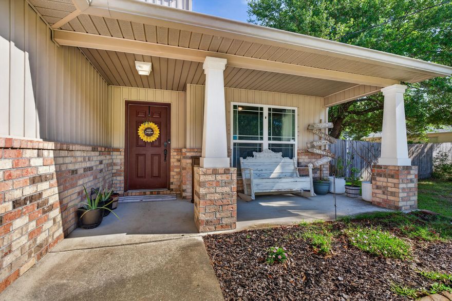 Welcome to your cozy Craftsman home--light, bright, and move-in ready. This 2014 two-story features an oversized split floor plan perfect for entertaining. Offering 4 bedrooms, 2.5 baths, plus a dedicated office off the foyer for work or study. The downstairs primary suite includes an ensuite bath with dual vanities, garden tub, and his-and-hers closets. Upstairs are three additional bedrooms and a full bath for privacy and comfort. The kitchen and dining area shine with granite countertops throughout. Large tile flooring runs through the main living areas, with tile in wet areas and carpet in bedrooms. Enjoy a .46-acre lot with room for a pool or outdoor living. A metal covered carport offers boat or RV storage. Close to top-rated schools, military bases, and beautiful beaches.