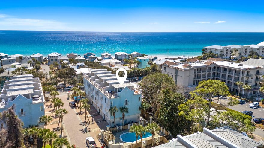Positioned in the heart of Gulf Place along Scenic Highway 30A, 27 Summer Place Lane captures the rhythm of coastal living with gulf views, exceptional walkability, and proven rental performance. Just steps from the deeded Ed Walline and Shell Seekers Cove beach accesses and an easy stroll to Shunk Gulley, Papa Surf Burger Bar, and the Gulf Place town center, this fully renovated end-unit townhome places everything that makes 30A iconic right outside your door. Spanning four thoughtfully designed levels, the residence offers four bedrooms and four full baths with a layout that consistently performs as a short-term rental. In 2025 alone, the property generated nearly $83,000 in gross rental income, with the calendar open to guests only 65 percent of the year, as the owners reserved significant time for personal enjoyment. A rare ground-floor lock-off suite with private entrance, kitchenette, and full bath provides flexibility for independent off-season rentals or private guest quarters. The main living level showcases an updated open kitchen with quartz countertops, a generous island, and KitchenAid stainless steel appliances, seamlessly flowing into inviting dining and living spaces designed for gathering after long beach days. A custom bunk room featuring two twin beds over a king sits on this level, paired with a full bath and walk-in shower, an ideal configuration for families and group stays. Upstairs, two king suites with private ensuite baths offer well-separated sleeping accommodations, creating comfort and privacy for both owners and guests. At the top, a private rooftop terrace serves as one of the home's most requested features, offering covered and open-air seating with captivating gulf views and coastal breezes. As the only unit with two dedicated parking spaces and immediate access to the seasonally heated community pool, the home stands apart within Summer Place. Offered fully furnished and turnkey, including five bicycles, it is ready for immediate enjoyment or continued income production. With an acceptable offer, the seller is also providing one year of HOA dues paid at closing, adding further value to this exceptional 30A opportunity.