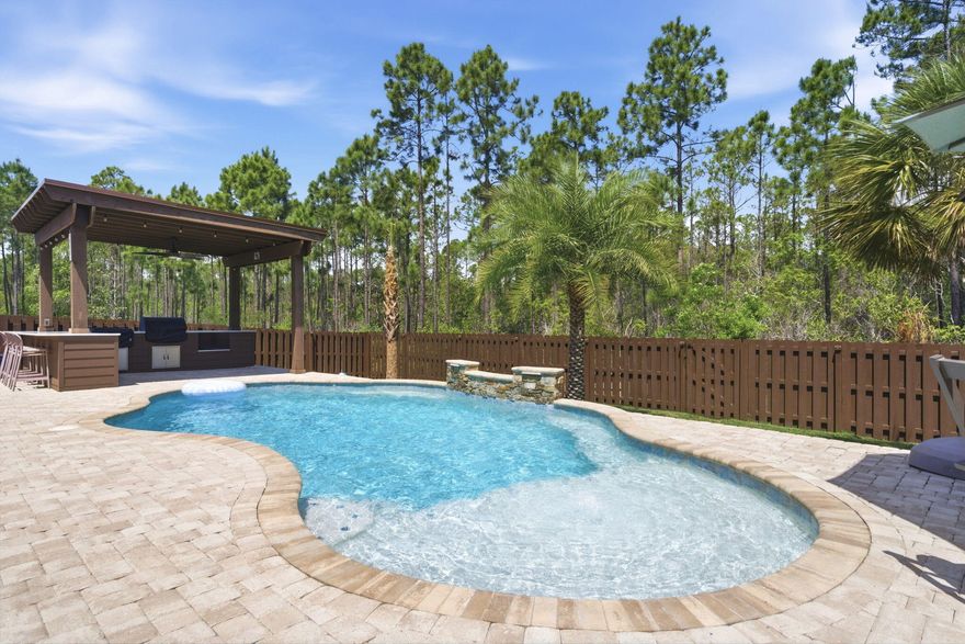 Welcome to luxury living in The Sanctuary on 5694 Oak Haven.

Tucked inside one of the area's most secluded and beautifully maintained neighborhoods, this exceptional pool home offers the kind of curb appeal and meticulous care that immediately stands out the moment you arrive. With underground utilities, elegant street lighting, and a low HOA, the community itself reflects pride of ownership from every neighbor along the street. From the moment you pull up, the stunning presentation sets the tone. Lush zoysia grass with a full irrigation system, expansive paver driveway, walkways, and pool decking, and professionally maintained landscaping create a truly impressive exterior. The home is perfectly positioned near a quiet cul-de-sac with one way in and out, eliminating cut-through traffic and creating a peaceful setting families truly appreciate.

Step inside and you'll immediately notice the sellers' exquisite attention to detail. Elegant **crystal glam chandeliers--even in the hallways--**add a touch of luxury throughout the home. The thoughtful split floor plan offers four spacious bedrooms, along with a private office with custom cabinetry, ideal for working from home while remaining tucked away from the main living areas.

The heart of the home flows beautifully into the backyard oasis. Your gunite pool with a soothing fountain creates the perfect atmosphere for relaxation while surrounded by gorgeous paver decking. Entertain effortlessly in the grilling gazebo, complete with a flat-top hibachi grill, Green Egg smoker, and oversized bar-top counter with seating--all conveying with the home and making this one of the most move-in-ready outdoor entertaining spaces on the market. And, if your own backyard oasis isn't enough, you'll only be 1 mile from the Woodlawn boat ramp!

Inside, the home features tile flooring throughout (no carpet), gas appliances, and a cozy gas-burning fireplace perfect for cooler evenings. The primary suite is a retreat, featuring a spacious spa-style bathroom that leads directly into a large walk-in closet with all-wood custom shelving--no wire racks anywhere. Even better, the laundry room connects directly to the closet, making everyday living effortless.

The additional bedrooms are privately situated on the opposite side of the home, providing comfort and separation for family or guests.

Outside, the backyard offers the privacy everyone hopes for, with a recently stained wood fence that preserves its natural beauty, while a whole-house generator system provides peace of mind year-round.

The home is slightly elevated leading to a wide double-car garage, allowing for excellent drainage and no standing water during heavy rains. There is an expansive amount of storage for the new homeowners in the garage as well. 

Every inch of this home reflects meticulous care--the floors, the walls, the finishes--everything has been maintained to an exceptional standard. Homes like this rarely become available in The Sanctuary at Oak Haven, where pride of ownership and peaceful living define the neighborhood. Keep an eye out for upcoming OPEN HOUSE dates--this is one you will not want to miss!! 

Welcome home.