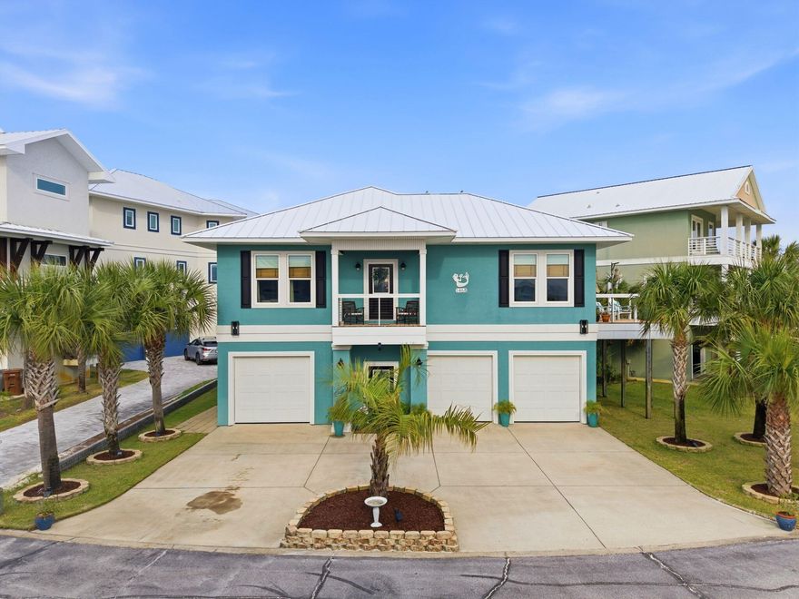 Welcome to Your Private Coastal Sanctuary in Caribbean Isle on Navarre Beach

From the moment you enter the exclusive, gated community of Caribbean Isle, you're transported into a true tropical paradise--complete with winding roads, vibrant coastal architecture, underground utilities, streetlights, and resort-style amenities including a community pool and tennis courts.

Perfectly positioned in one of the most desirable locations within the neighborhood, this custom-built, one-owner beach home offers the ultimate blend of privacy, convenience, and luxury. Just steps from your back door, you'll find direct access to the sugar-white sands and emerald waters of the beach. Enjoy peaceful morning strolls along the quiet shoreline, or head just across the street to experience the energy of Gulf. Designed for Coastal Living & Entertaining

This thoughtfully designed residence features four spacious sleeping areas, including a custom bunk room with built-in beds and storage--perfect for hosting family and guests. Every inch of this home reflects intentional design and elevated coastal style.

The main living spaces are pouring with natural light, enhanced by expansive windows and three generous porches that capture both sunrise and sunset views. With water views from nearly every angle, the connection to the coast is felt throughout the home.

The chef's kitchen is a true showpiece, featuring ceiling-height light blue cabinetry, upgraded countertops, designer sconce lighting, and an open layout ideal for entertaining.

Exceptional Features Inside & Out

Impact-rated glass for enhanced durability and lower insurance costs

Luxury vinyl plank flooring with a soft driftwood finish

Custom cable railing on decks for unobstructed water views

Metal roof for long-term durability

Deep soaking tub and designer tile shower in the primary suite

Abundant storage throughout, including a space designed for a future elevator (plans available upon request)

Ground Level Coastal Retreat

The lower level offers an incredible flex space--ideal for a den, game room, or "man cave"--featuring a unique glass garage door that allows natural light to pour in while maintaining privacy. Just outside, a private outdoor shower provides the perfect spot to rinse off after a day at the beach. (This was not added into the upstairs square footage.) 

With over 1,600 square feet of garage space, there's ample room for multiple vehicles, golf carts, and all your beach and boating gear.

Outdoor Living at Its Finest

The professionally enhanced landscaping, complete with multiple palm trees, perfectly frames the home and enhances its tropical curb appeal. Every outdoor space invites relaxation, from breezy porches to shaded areas below.

Additional Highlights

Located in the gated community of Caribbean Isle

Low HOA: $485/quarter

Flood Insurance: ~$996/year

Homeowners Insurance: ~$3,700/year

Furniture negotiable with acceptable offer

This meticulously maintained home offers not just a residence, but a lifestyle--where every day feels like a vacation.

Experience the beauty, comfort, and luxury of Navarre Beach living in Caribbean Isle. Schedule your private showing today. The community has an annual Road Reserve of $300.00 in addition to annual HOA dues. Buyer to verify all information deemed important to buyer including but not limited to lot size, room measurements, etc. prior to closing